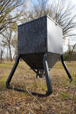 Monarch 600 lb automatic deer feeder in field setting