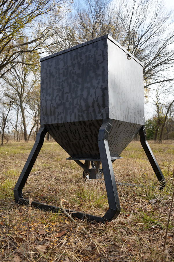 Monarch 600 lb automatic deer feeder in field setting
